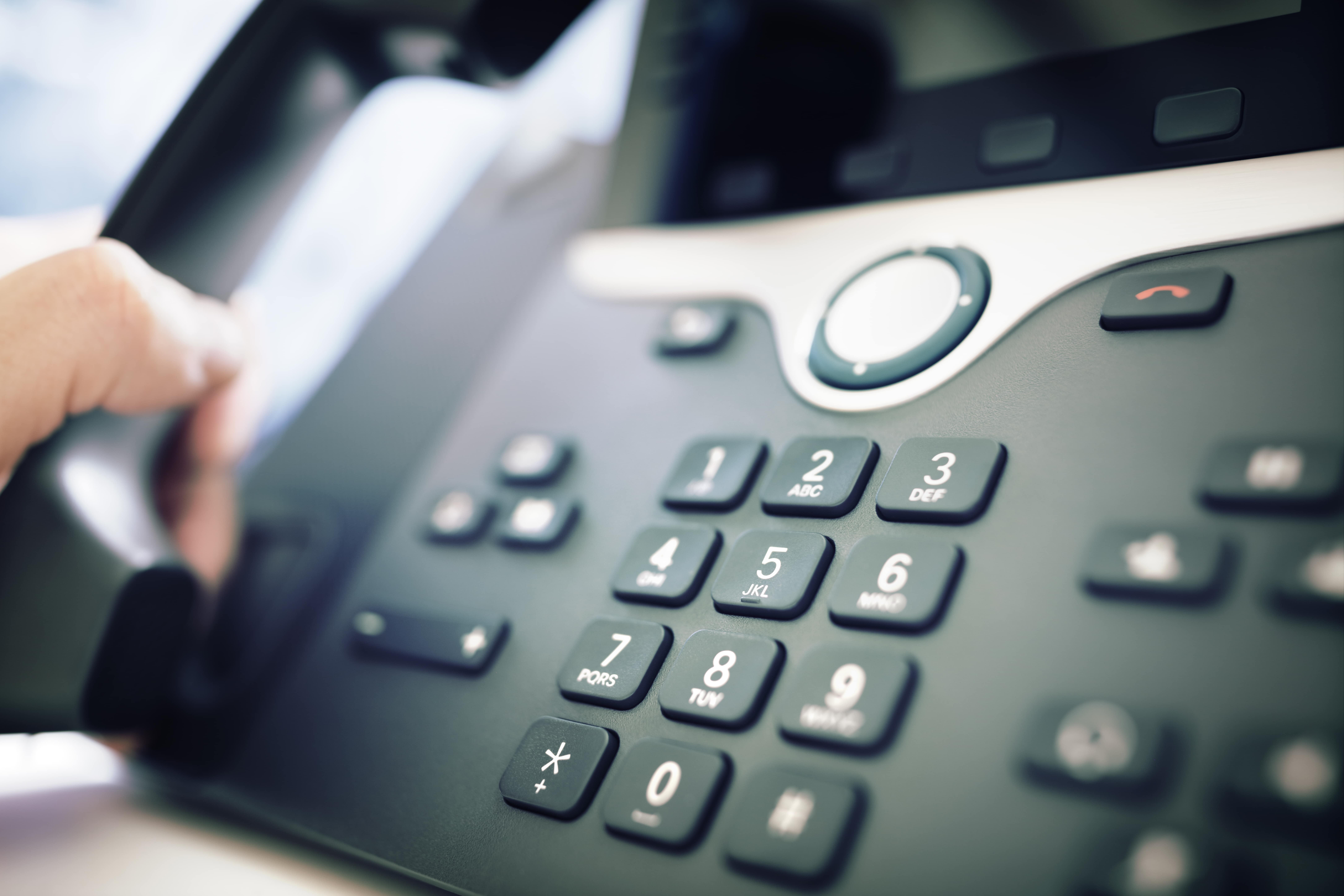 dialing a telephone in the office 2021 08 26 22 29 57 utc min